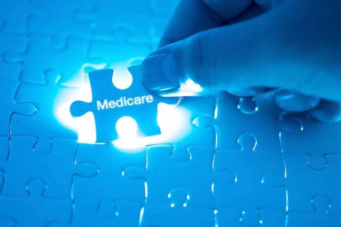 Hand placing a puzzle piece labeled Medicare