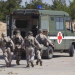 CENTCOM Confirms Deaths — Missing Troop Mystery Soldiers running towards a medical vehicle during a military operation
