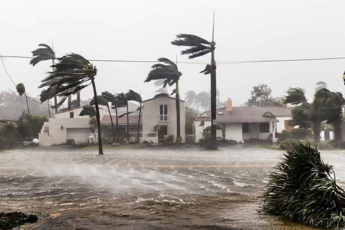 Houses battered by hurricane winds and flooding