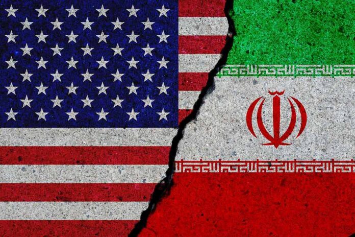 shutterstock_1399072814 U.S. and Iran flags split by a jagged crack