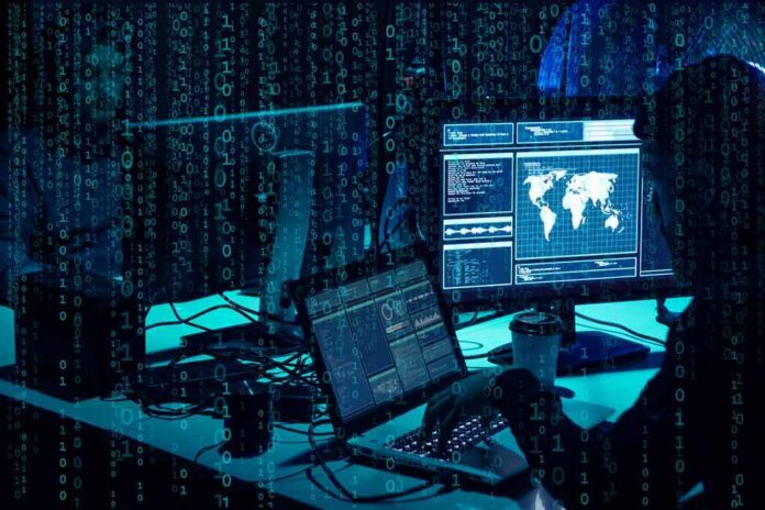 shutterstock_1399823822 cybersecurity analysts at workstations with code and world map on screens