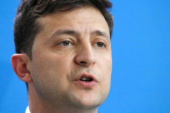 June,18,,2019,-,Berlin:,Volodymyr,Zelensky,-,Meeting,Of Volodymyr Zelensky speaking in a close-up portrait against a blue background