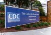 Ethics Firestorm: HHS Chief Rejoins CHD CDC headquarters entrance sign in Atlanta