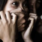 Kidnapped Student Outsmarts Attacker With One Tap woman with hands covering her mouth in fear