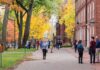 DEI Axed: Maryland Locks New Language Students walking through a leafy campus path in autumn