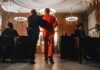Convicted Teen Deported After Fairfax Assaults Prisoner in orange jumpsuit escorted by officer in a courtroom
