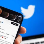 Smartphone displaying a social media profile on Twitter app