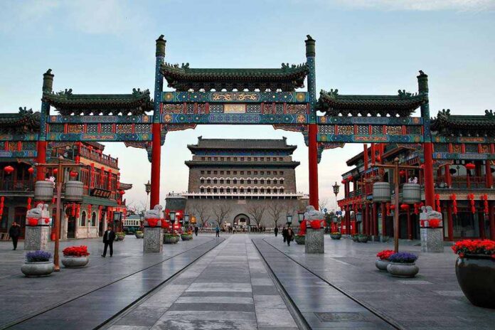A vibrant traditional Chinese gateway with ornate decorations in an urban setting