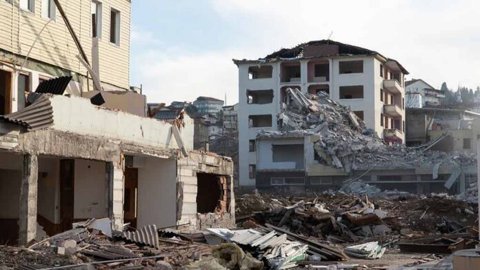 Collapsed apartment buildings amid heavy rubble