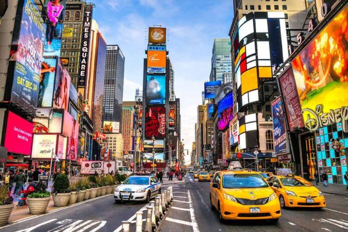 Times Square street with yellow taxis and bright billboards