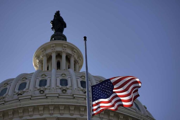 U.S. flag waves before the Capitol dome
