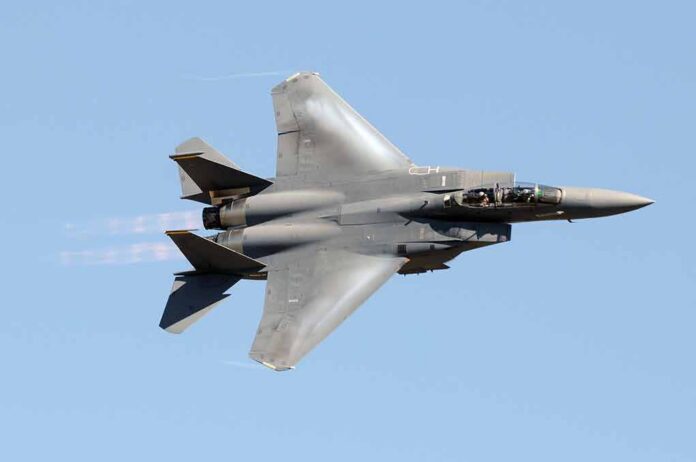 fighter jet banking in clear sky