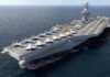 Aircraft carrier at sea with fighter jets on deck