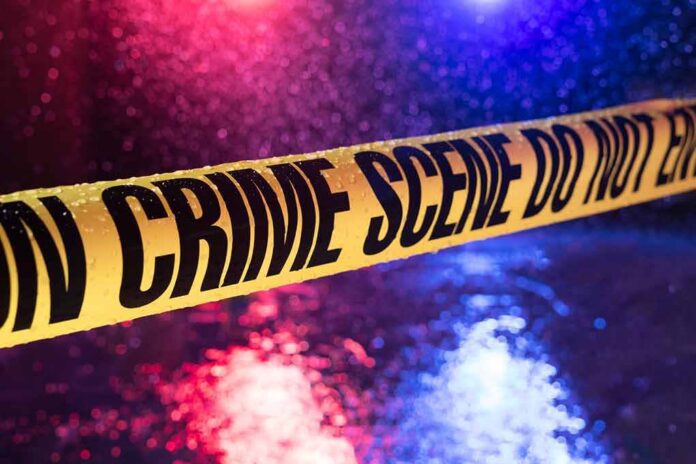 crime scene tape with police lights in rain