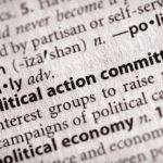 Close-up of a dictionary entry for political action committee
