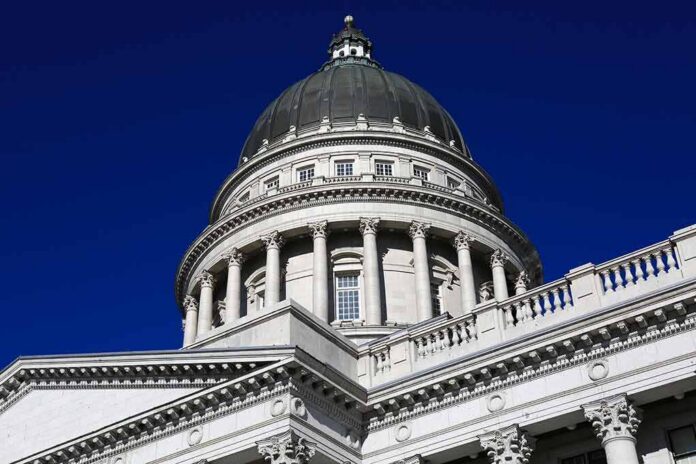 Capitol building dome with columns against a deep blue sky