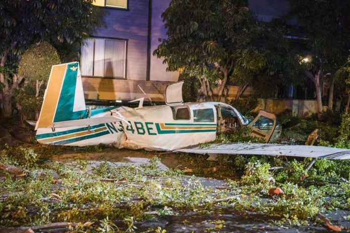 small airplane crash in residential area at night