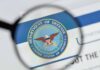 magnifying glass focusing on U.S. Department of Defense seal