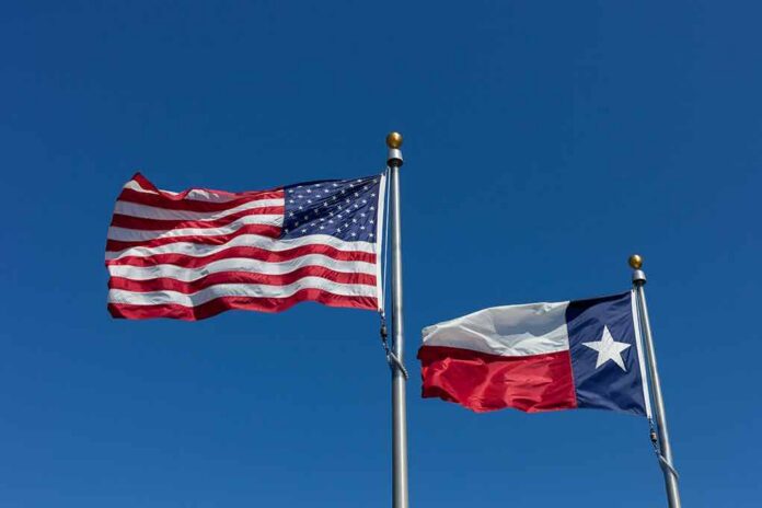 American and Texas flags waving on flagpoles