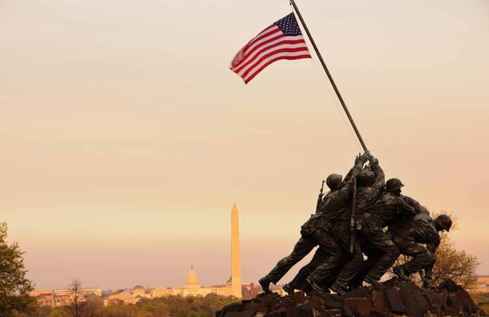 Iwo Jima Memorial with soldiers raising the American flag at sunset