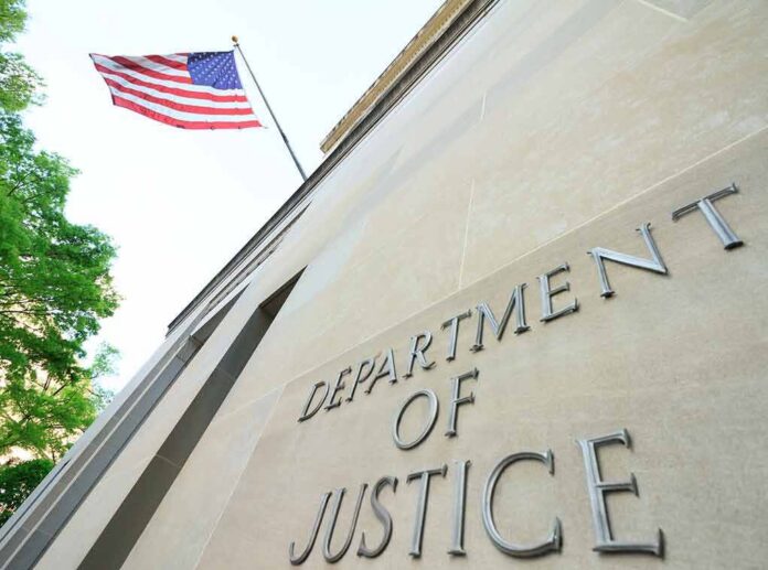 shutterstock_1384089731 Department of Justice building with American flag