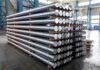 Foreign Steel Jackpot, Iowa Cuts Checks? Stacked metal rods on pallets in an industrial warehouse