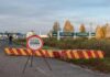 Ukraine border crossing with stop sign and barrier