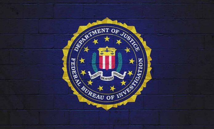 FBI seal painted on a dark brick wall