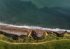 Aerial view of rugged coastal cliffs and shoreline