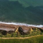 Aerial view of rugged coastal cliffs and shoreline