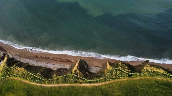 Aerial view of rugged coastal cliffs and shoreline