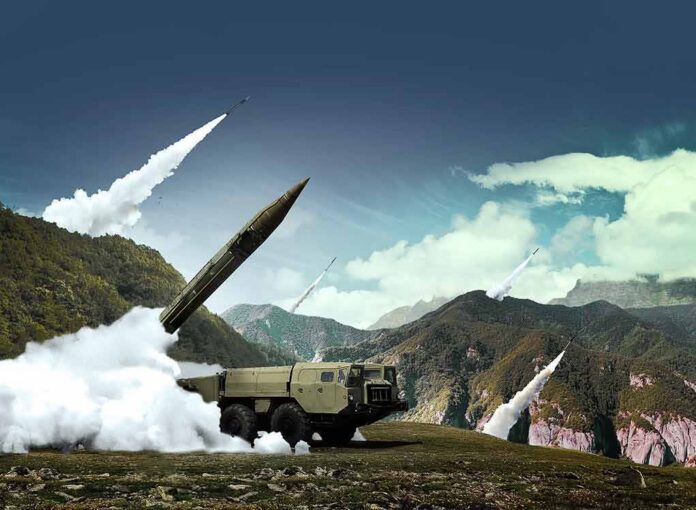 mobile missile launcher firing in mountain landscape